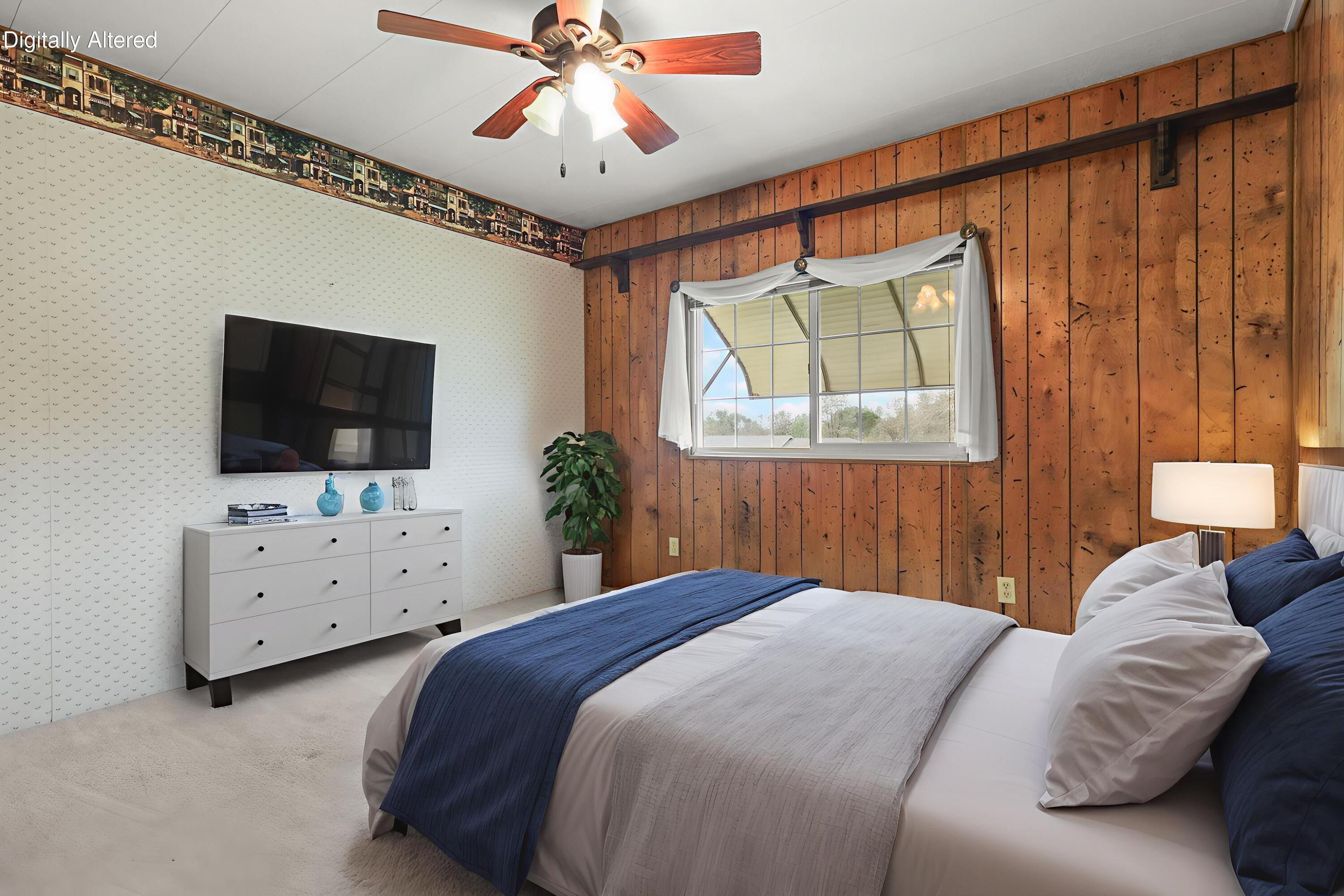 836 August Way Redding, CA 96003 - Photo 18 of 32 a bedroom with a bed chandelier and flat screen tv