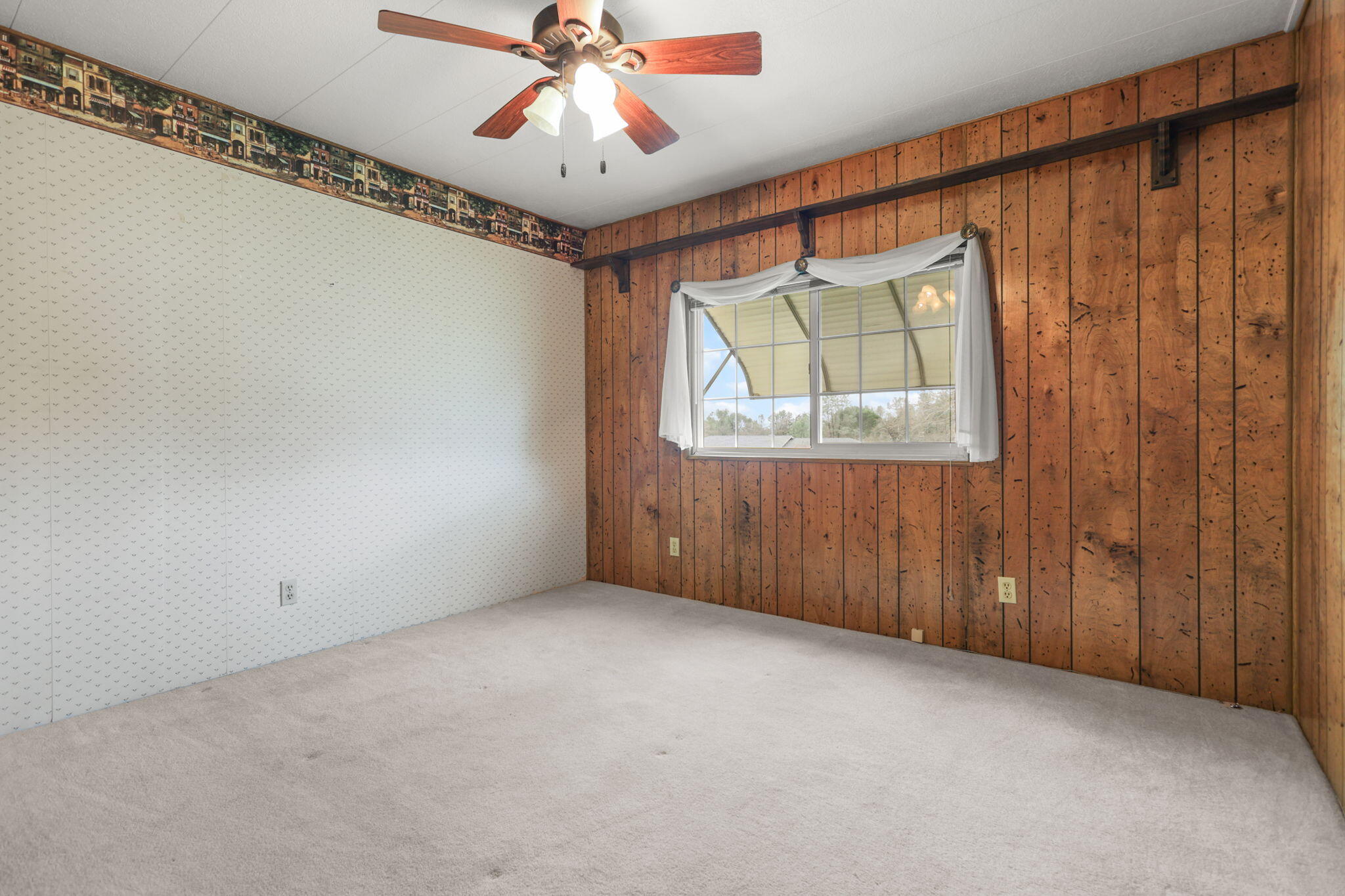 836 August Way Redding, CA 96003 - Photo 19 of 32 a view of an empty room with a window