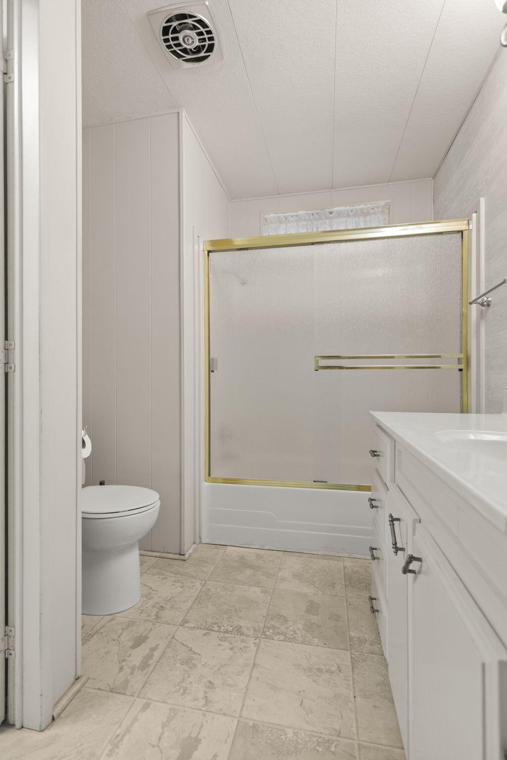 836 August Way Redding, CA 96003 - Photo 23 of 32 a bathroom with a granite countertop shower a toilet and a sink