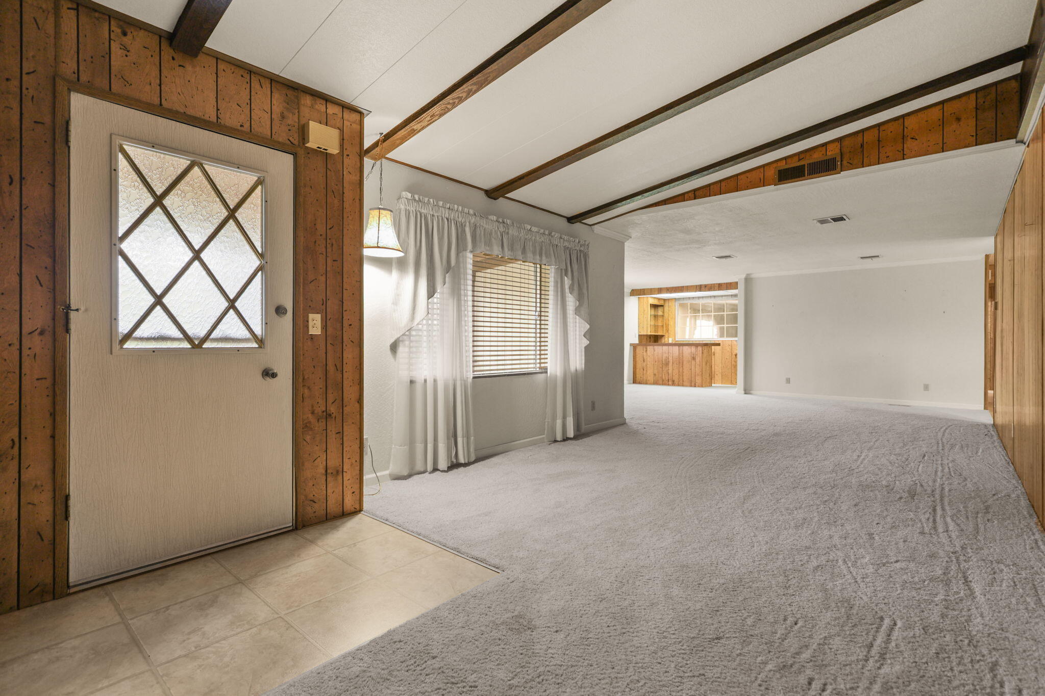 836 August Way Redding, CA 96003 - Photo 7 of 32 a view of an empty room with a window