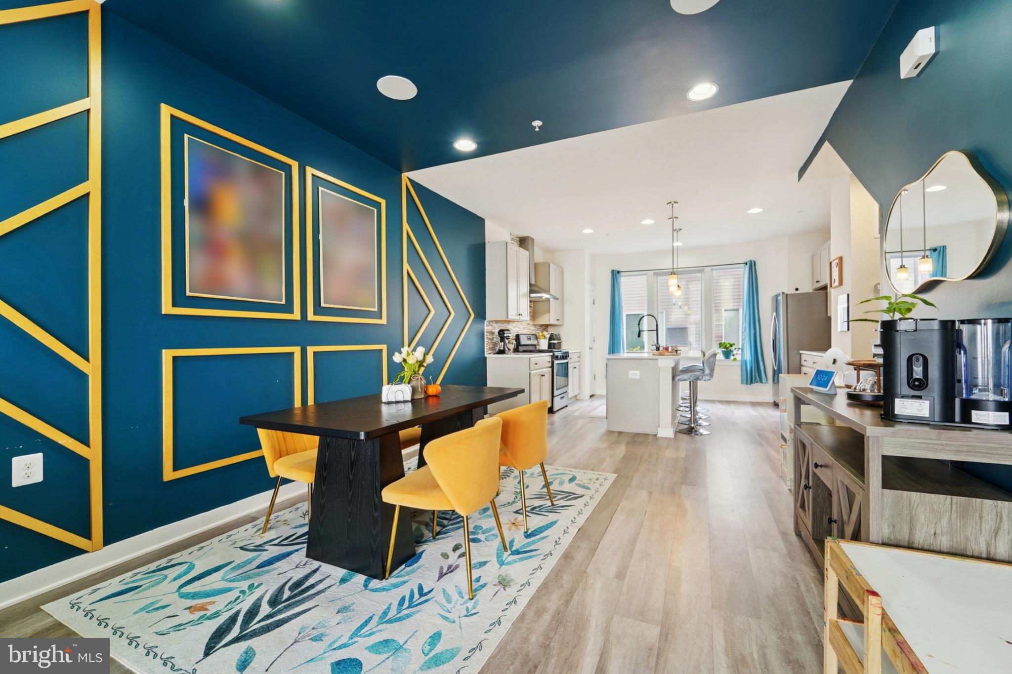 1410 Bexley Lane Frederick, MD 21701 - Photo 14 of 34 a living room with furniture a rug kitchen view and a large window