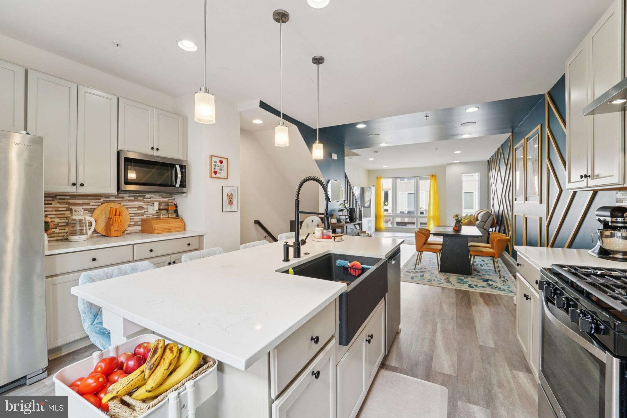 1410 Bexley Lane Frederick, MD 21701 - Photo 17 of 34 a kitchen that has a stove a sink and a microwave