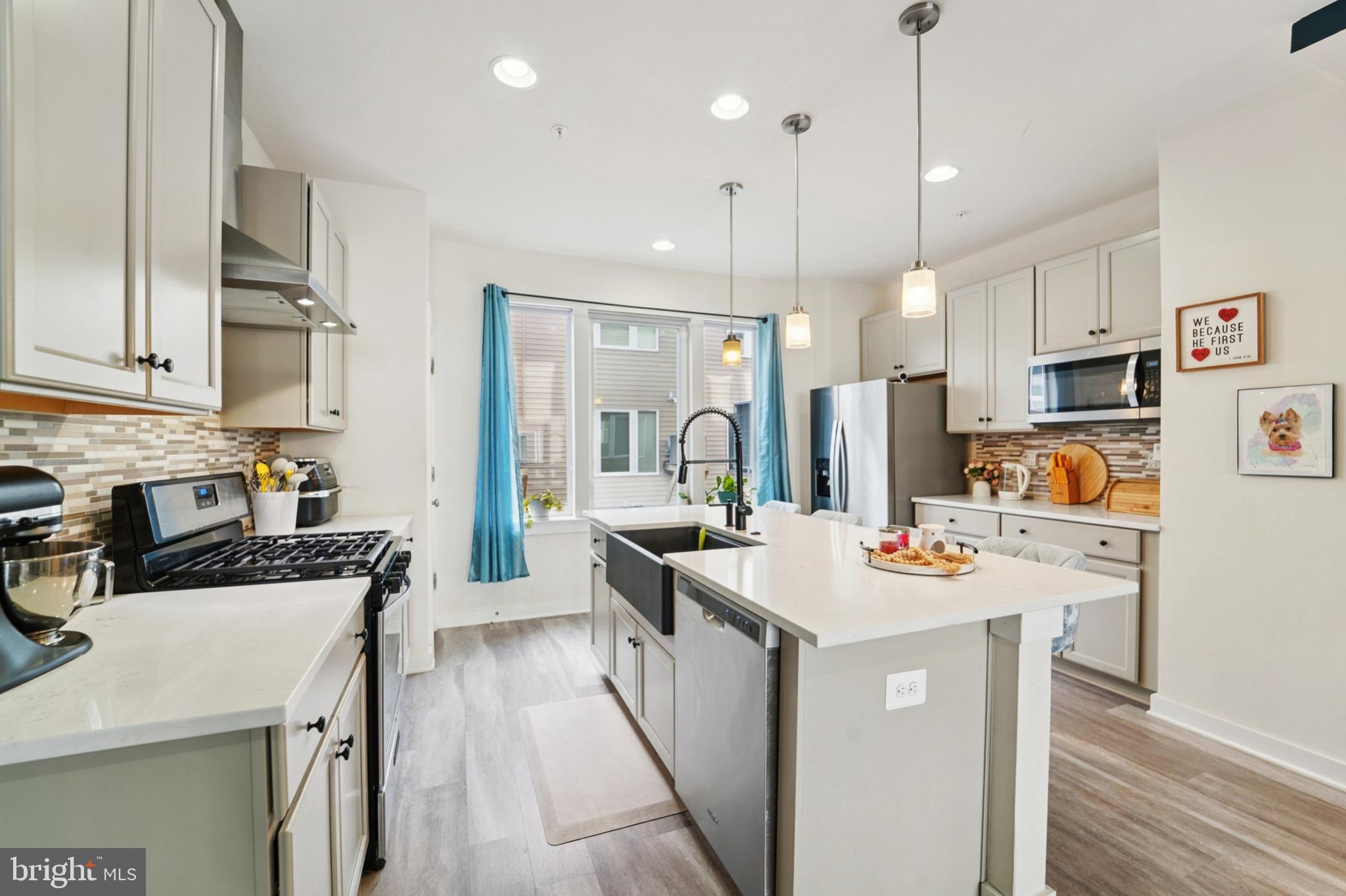 1410 Bexley Lane Frederick, MD 21701 - Photo 18 of 34 a kitchen that has a lot of cabinets a sink and appliances
