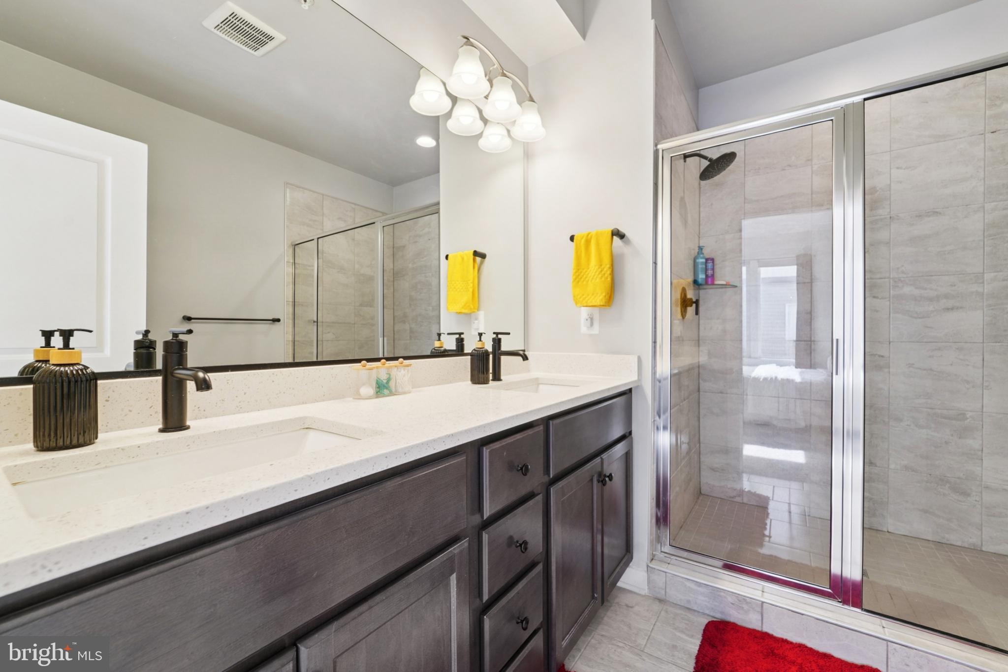 1410 Bexley Lane Frederick, MD 21701 - Photo 25 of 34 a bathroom with a double vanity sink mirror and double
