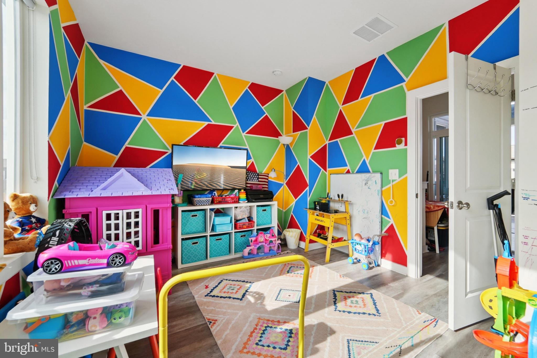 1410 Bexley Lane Frederick, MD 21701 - Photo 28 of 34 a room that has a bed and a couch