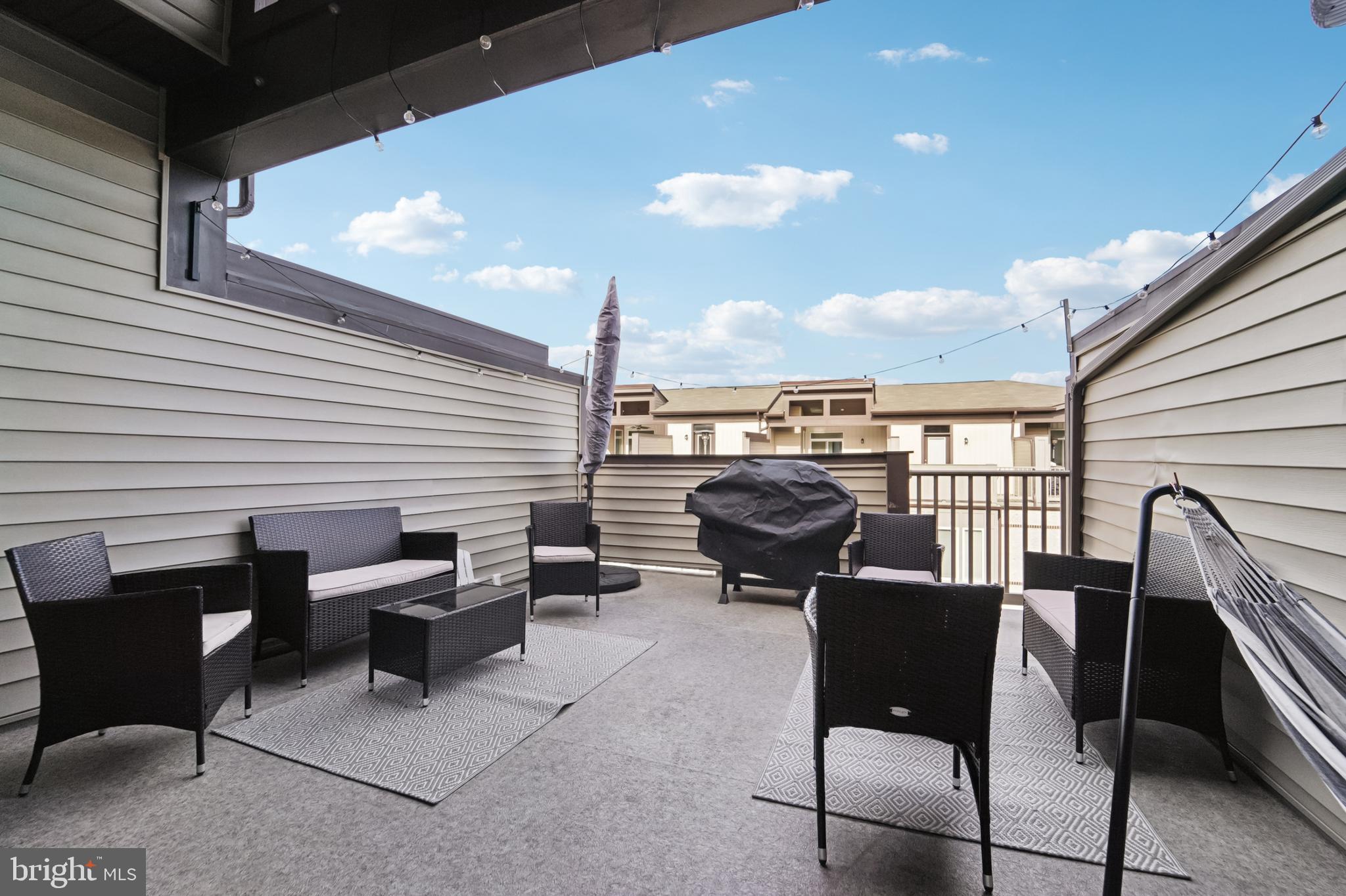 1410 Bexley Lane Frederick, MD 21701 - Photo 30 of 34 a backyard of a house with table and chairs