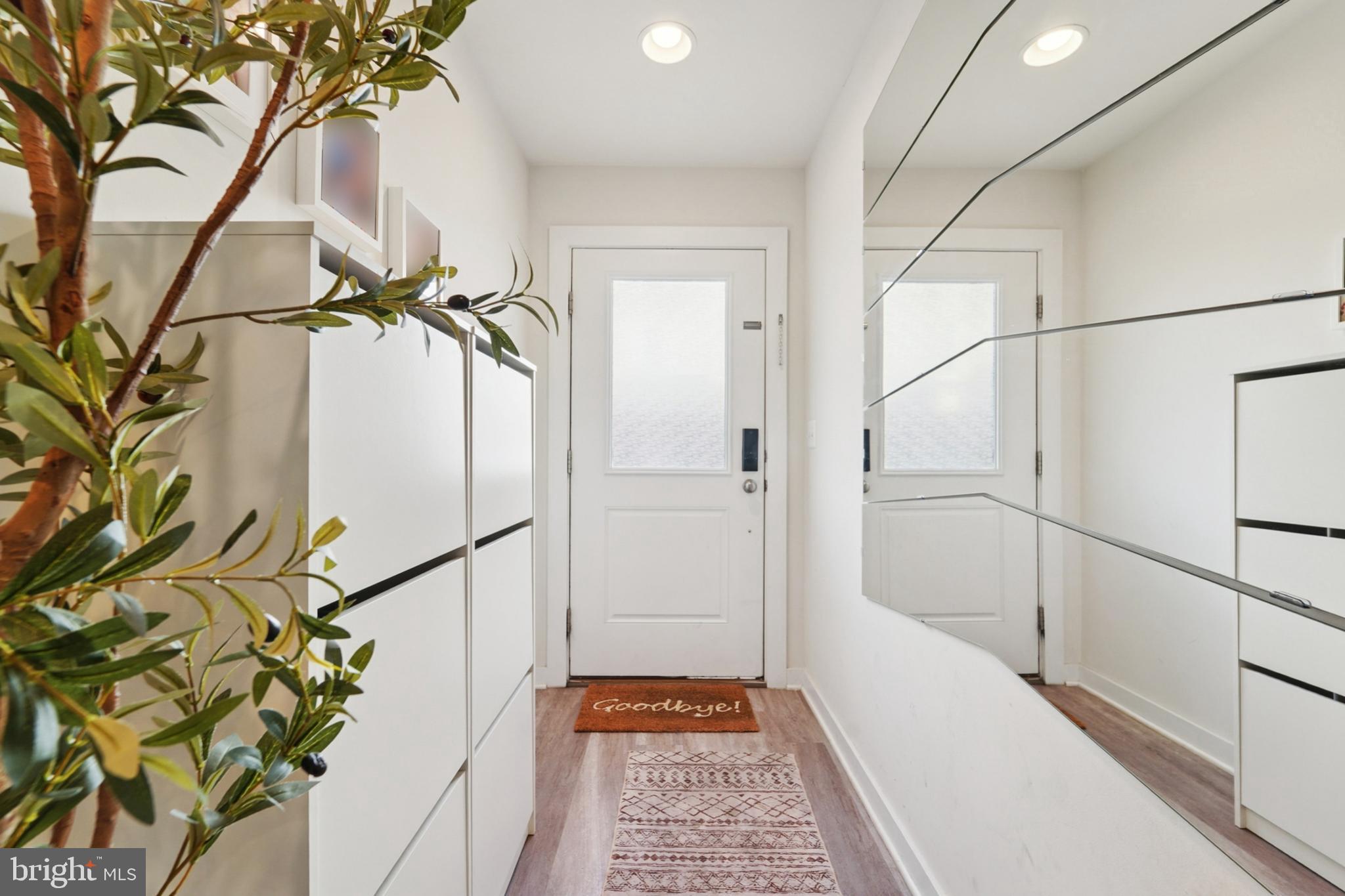 1410 Bexley Lane Frederick, MD 21701 - Photo 5 of 34 a bathroom with a shower and a glass door