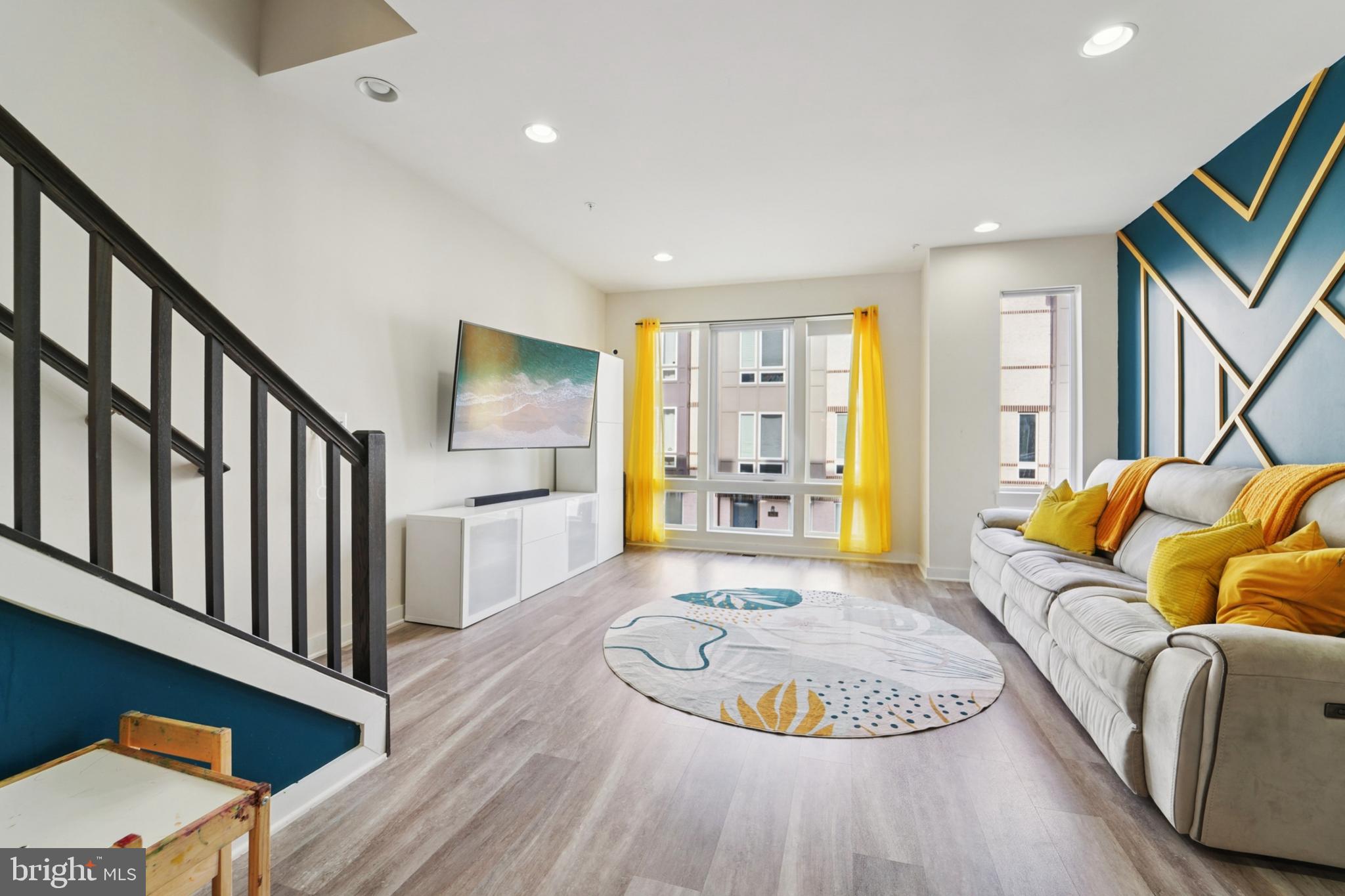 1410 Bexley Lane Frederick, MD 21701 - Photo 10 of 34 a living room with furniture and a wooden floor