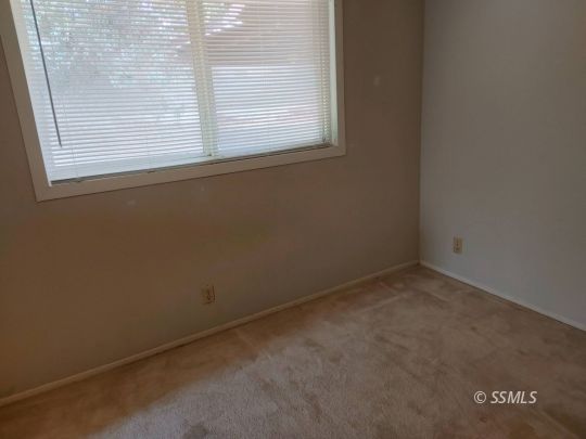 1014 Sherri Street Ridgecrest, CA 93555 - Photo 8 of 23 an empty room with a window