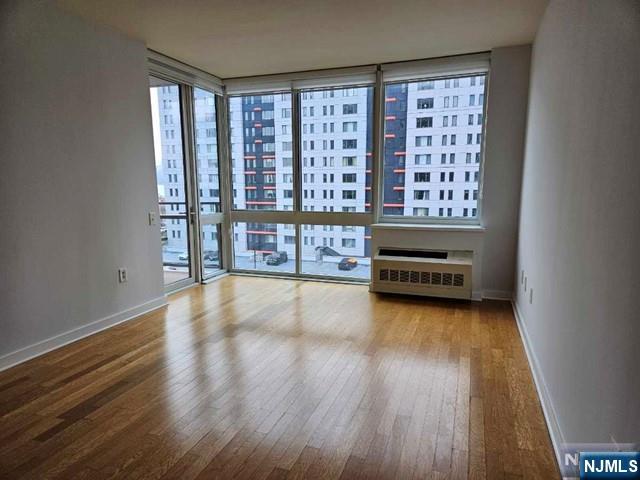 807 Hudson Park Edgewater, NJ 07020 - Photo 4 of 27 wooden floor and windows in a room