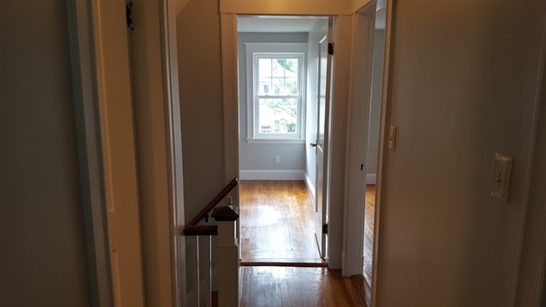 14 Governors Road Milton, MA 02186 - Photo 13 of 19 a view of hallway with wooden floor