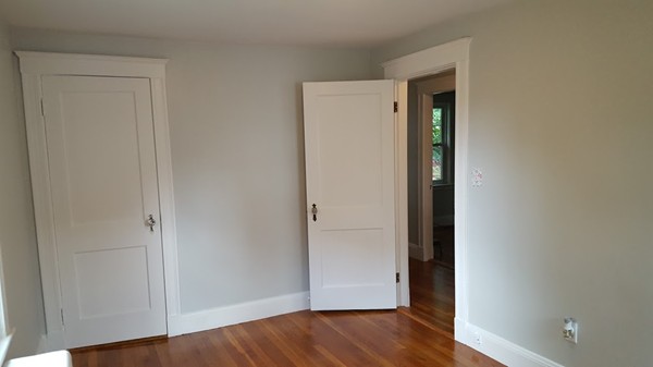 14 Governors Road Milton, MA 02186 - Photo 17 of 19 a view of an empty room with wooden floor