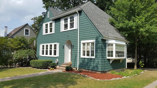 14 Governors Road Milton, MA 02186 - Photo 2 of 19 a front view of a house with a yard