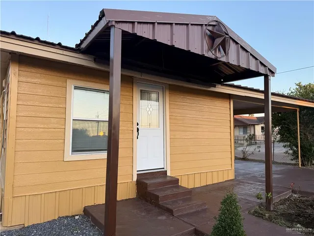 a view of a house with a wooden door