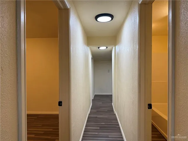 a view of a bathroom from a hallway
