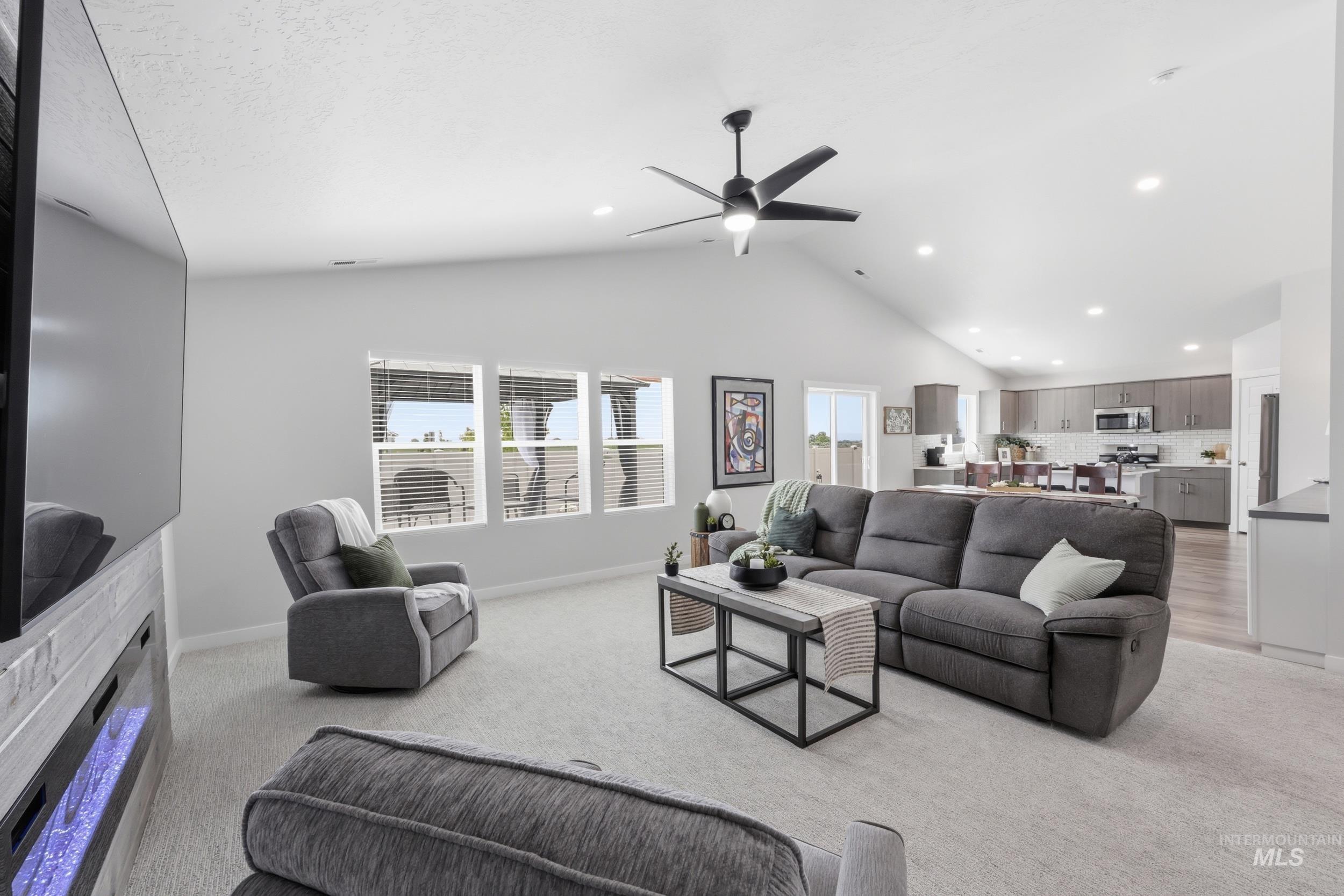 3665 W Lane Meridian, ID 83642 - Photo 19 of 42 Expansive backyard featuring a gravel patio area, raised garden beds, and a perimeter privacy fence