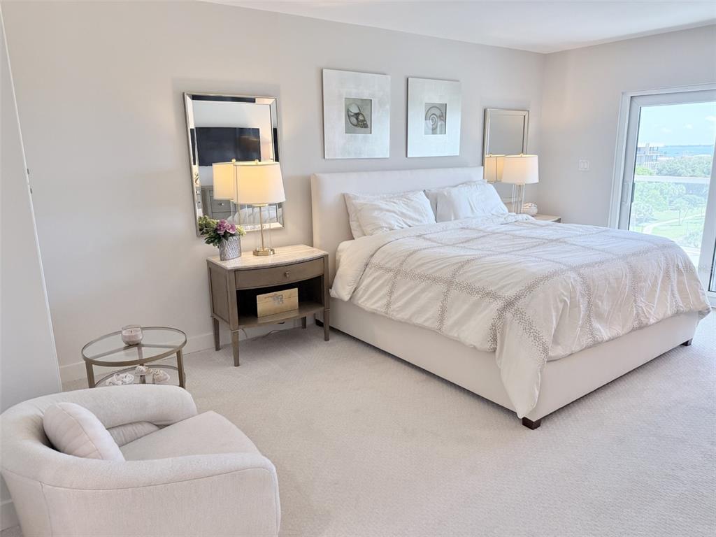 1050 Longboat Club Road, Unit 803 Longboat Key, FL 34228 - Photo 22 of 39 a bedroom with a bed and a couch