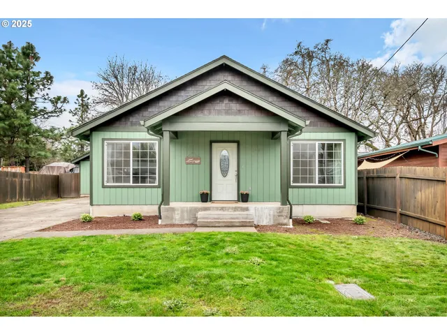 a view of a house with a yard