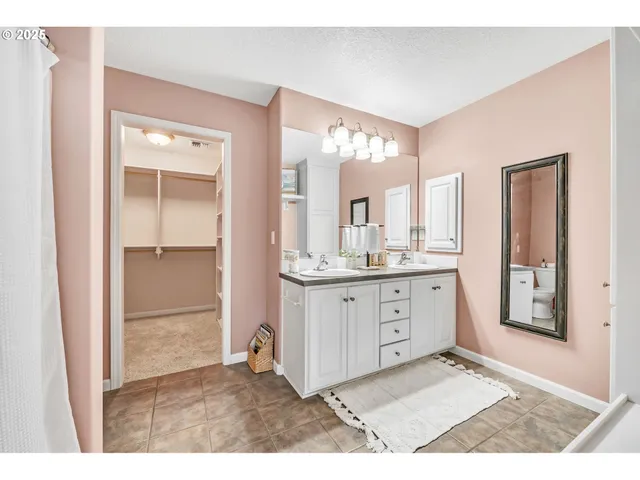 a bathroom with a sink a mirror and a vanity