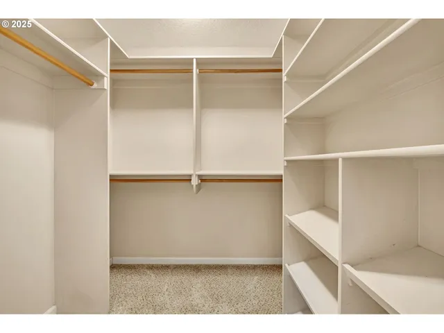 a view of an empty walk in closet