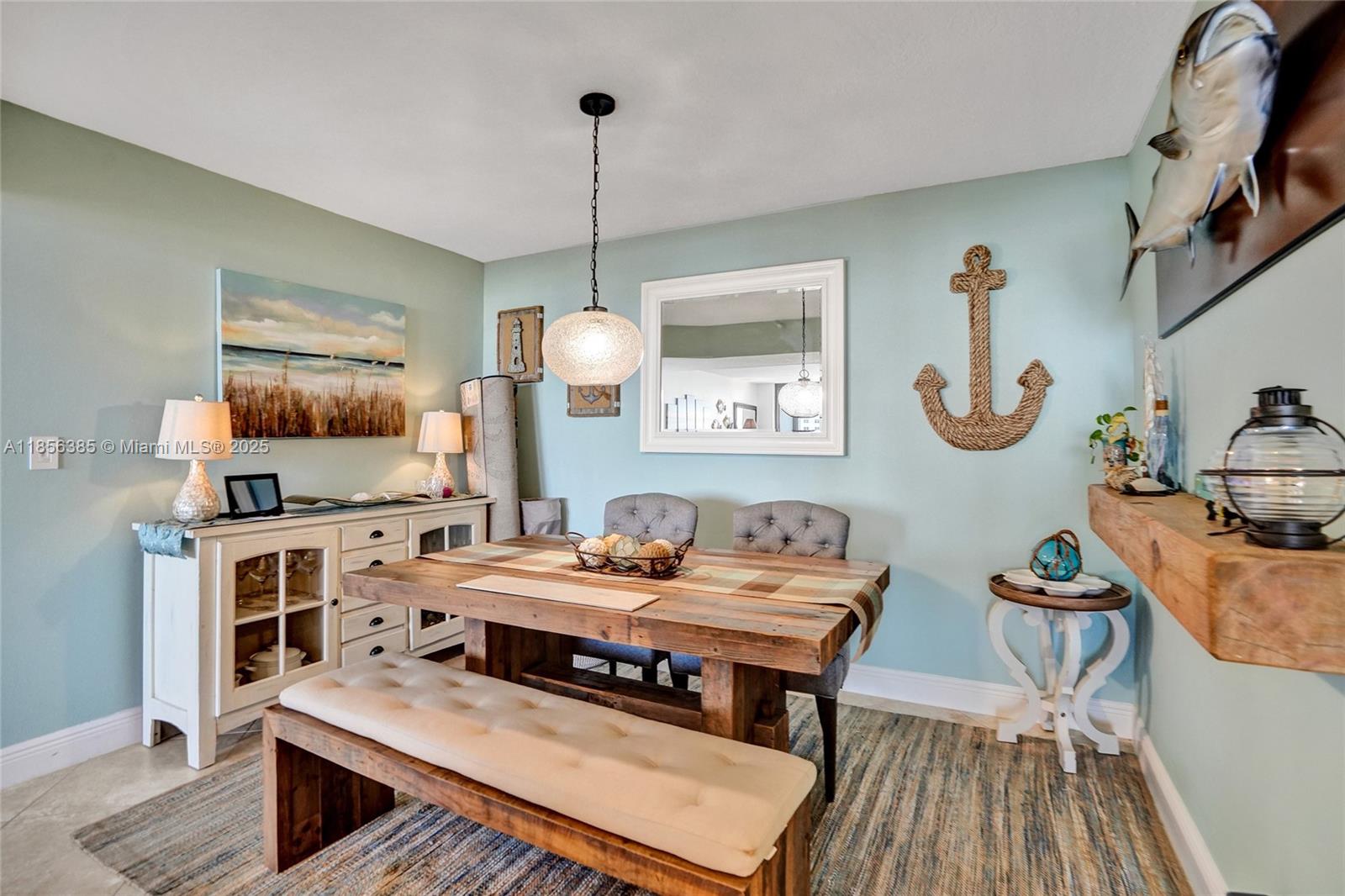 1500 North Ocean Boulevard, Unit 801 Pompano Beach, FL 33062 - Photo 11 of 58 a living room with furniture and a wooden floor