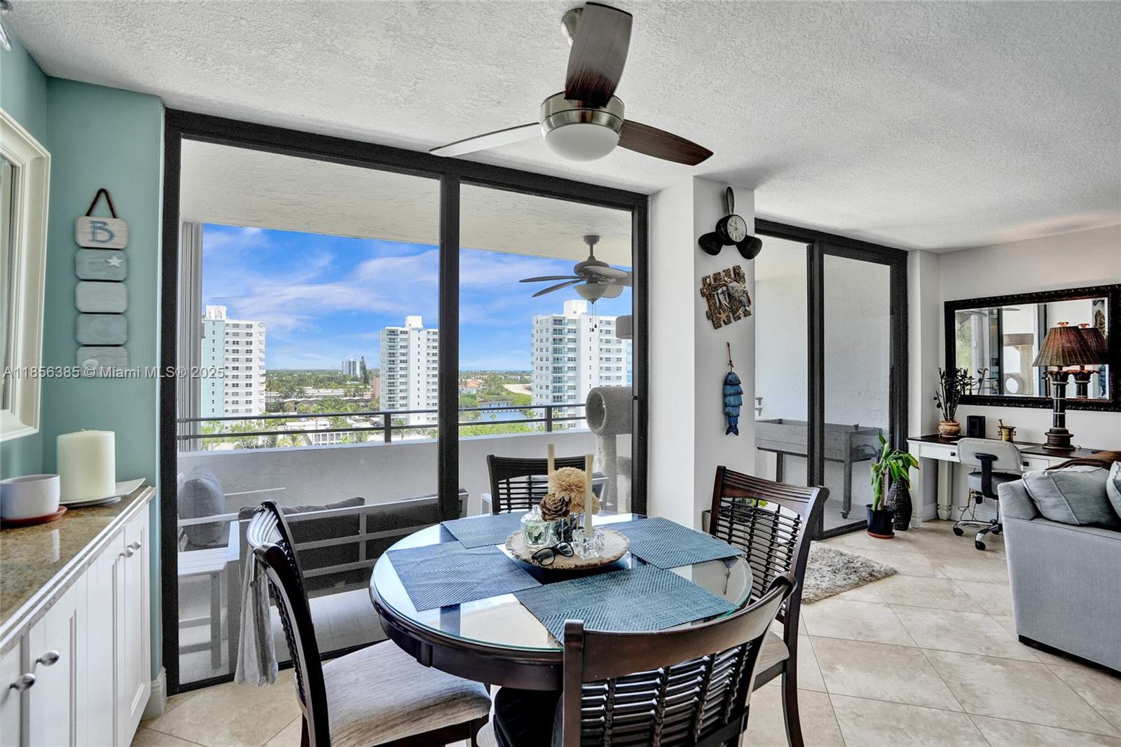 1500 North Ocean Boulevard, Unit 801 Pompano Beach, FL 33062 - Photo 14 of 58 a view of a dining room with furniture large windows and wooden floor