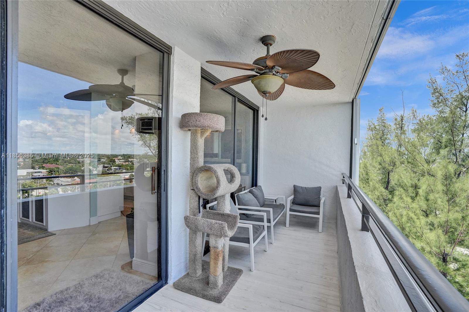 1500 North Ocean Boulevard, Unit 801 Pompano Beach, FL 33062 - Photo 17 of 58 a kitchen with stainless steel appliances granite countertop furniture and a wooden floor