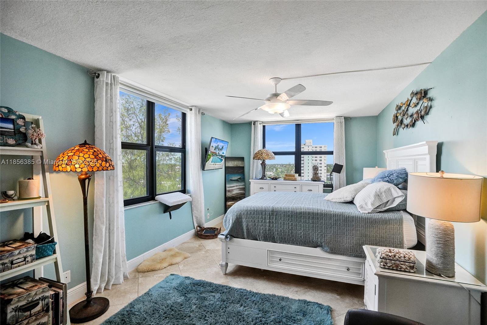 1500 North Ocean Boulevard, Unit 801 Pompano Beach, FL 33062 - Photo 19 of 58 a bedroom with furniture and a window