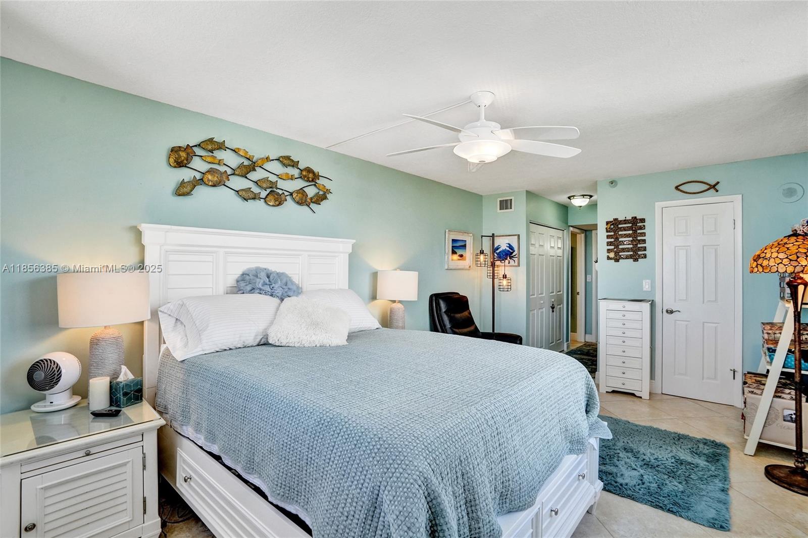 1500 North Ocean Boulevard, Unit 801 Pompano Beach, FL 33062 - Photo 20 of 58 a bedroom with a bed and wooden floor