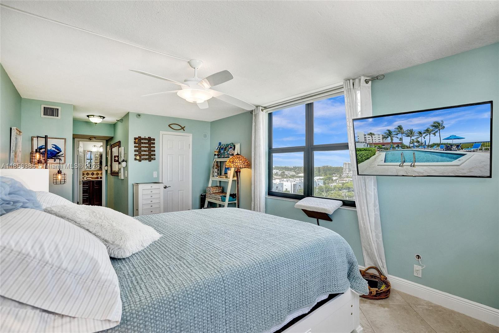 1500 North Ocean Boulevard, Unit 801 Pompano Beach, FL 33062 - Photo 22 of 58 a bedroom with a large bed and a window