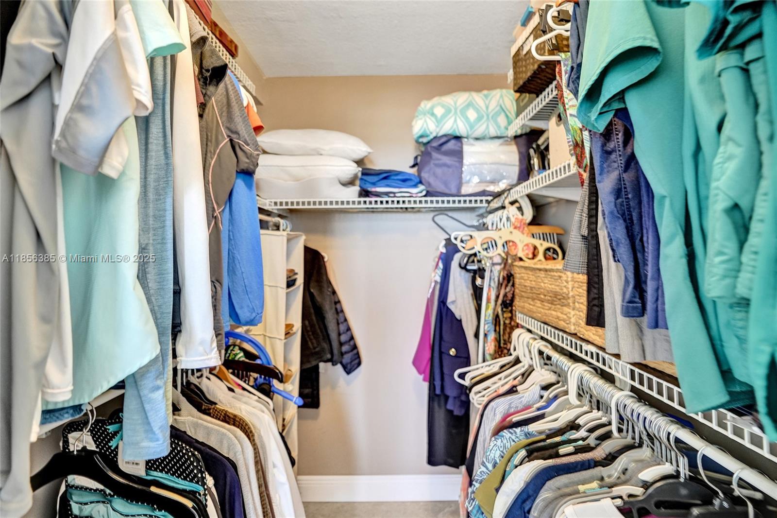1500 North Ocean Boulevard, Unit 801 Pompano Beach, FL 33062 - Photo 23 of 58 a view of walk in closet with clothes