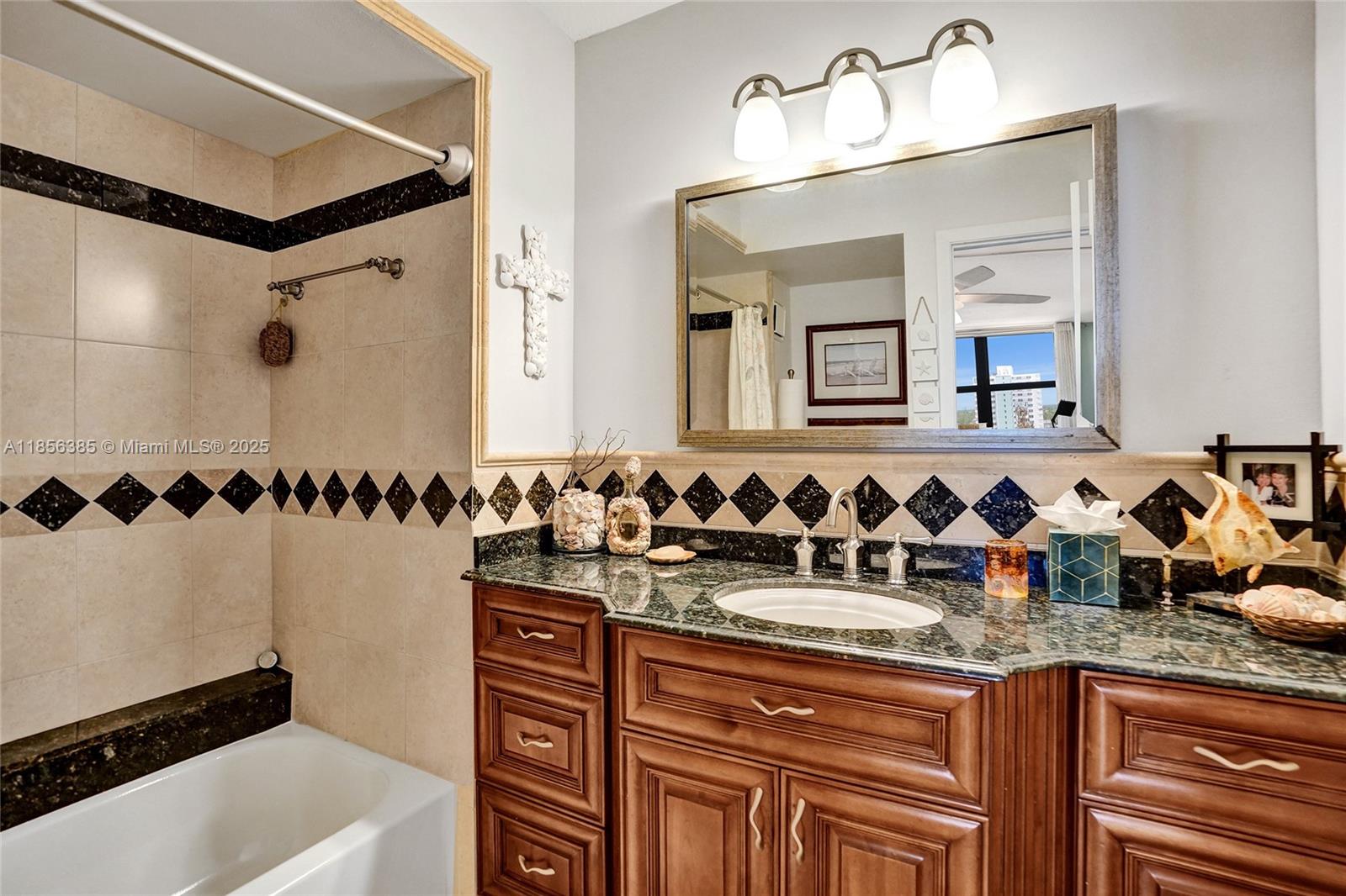 1500 North Ocean Boulevard, Unit 801 Pompano Beach, FL 33062 - Photo 24 of 58 a bathroom with a sink and a mirror