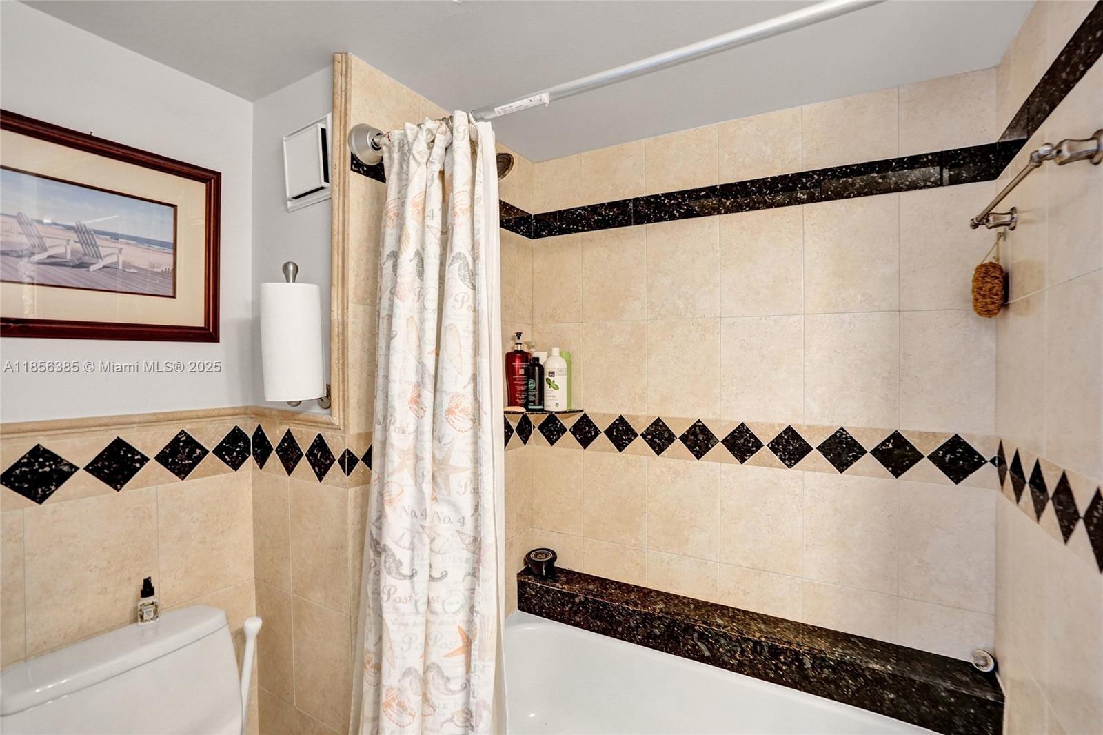 1500 North Ocean Boulevard, Unit 801 Pompano Beach, FL 33062 - Photo 25 of 58 a view of a bathroom with a shower and a sink