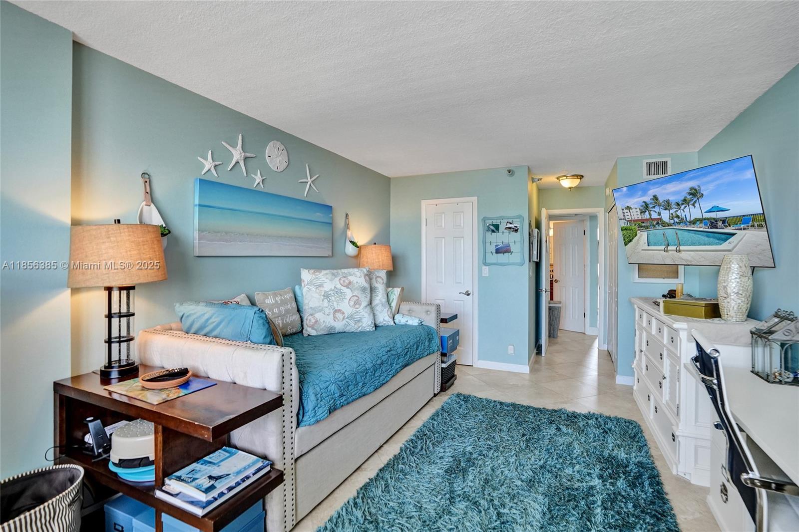 1500 North Ocean Boulevard, Unit 801 Pompano Beach, FL 33062 - Photo 37 of 58 a living room with furniture and a table