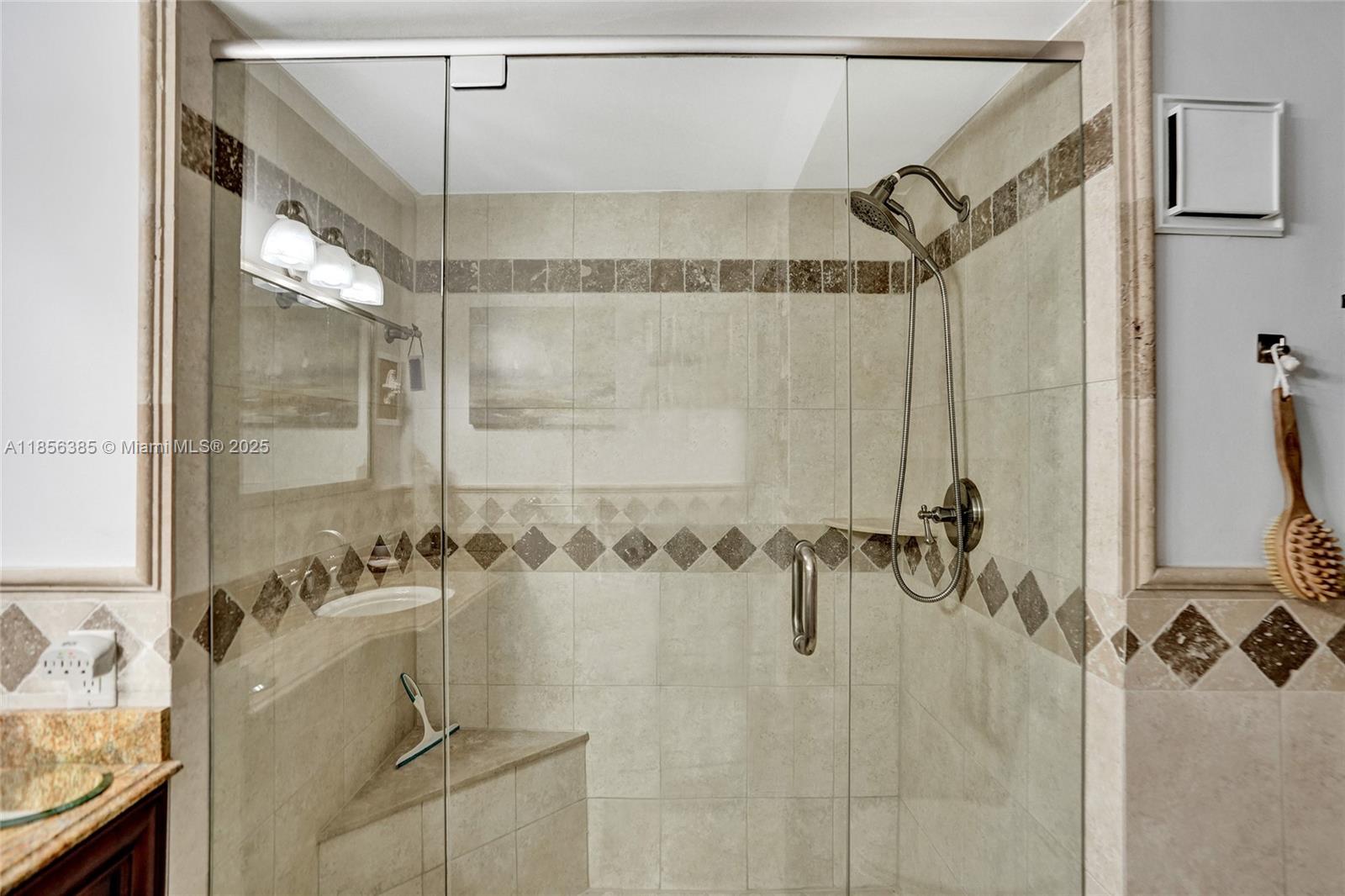 1500 North Ocean Boulevard, Unit 801 Pompano Beach, FL 33062 - Photo 39 of 58 a bathroom with a shower and a mirror