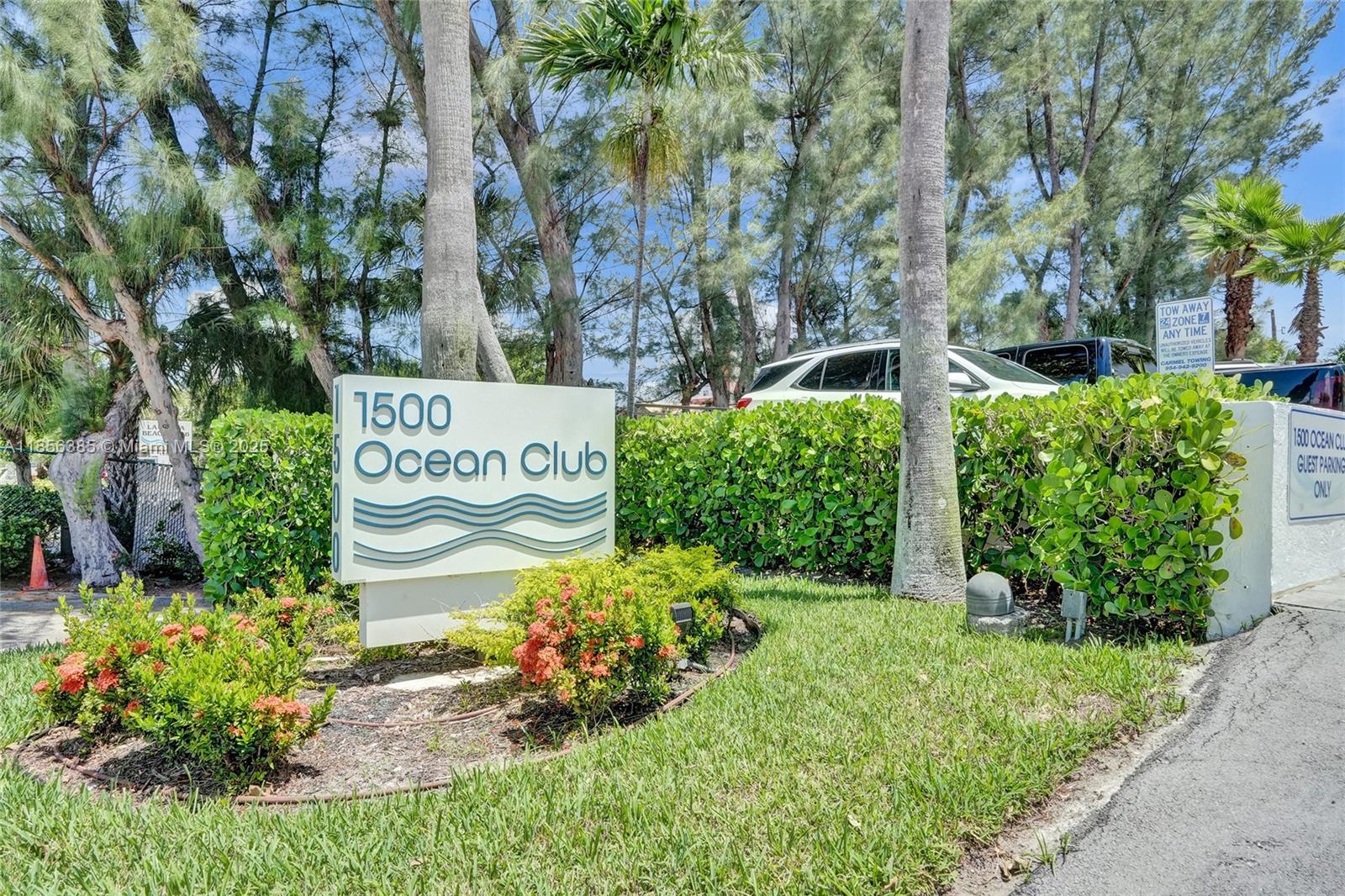 1500 North Ocean Boulevard, Unit 801 Pompano Beach, FL 33062 - Photo 43 of 58 a sign that is in front of flowers