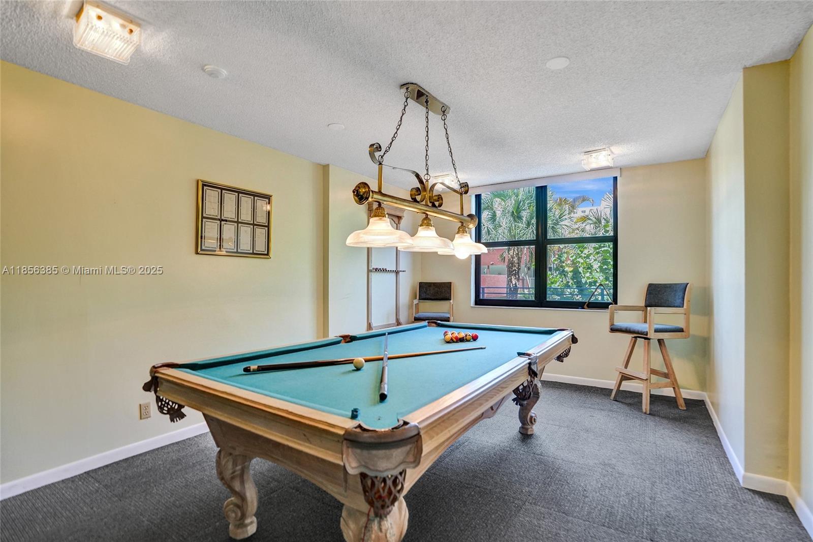 1500 North Ocean Boulevard, Unit 801 Pompano Beach, FL 33062 - Photo 47 of 58 a room with pool table and windows
