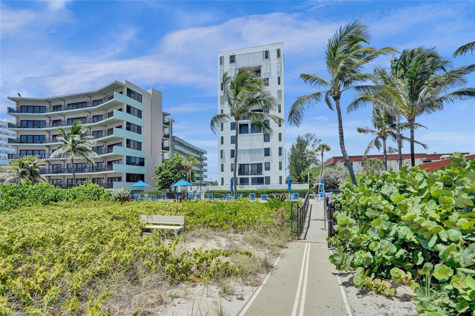 1500 North Ocean Boulevard, Unit 801 Pompano Beach, FL 33062 - Photo 57 of 58 a view of a garden with a building in the background