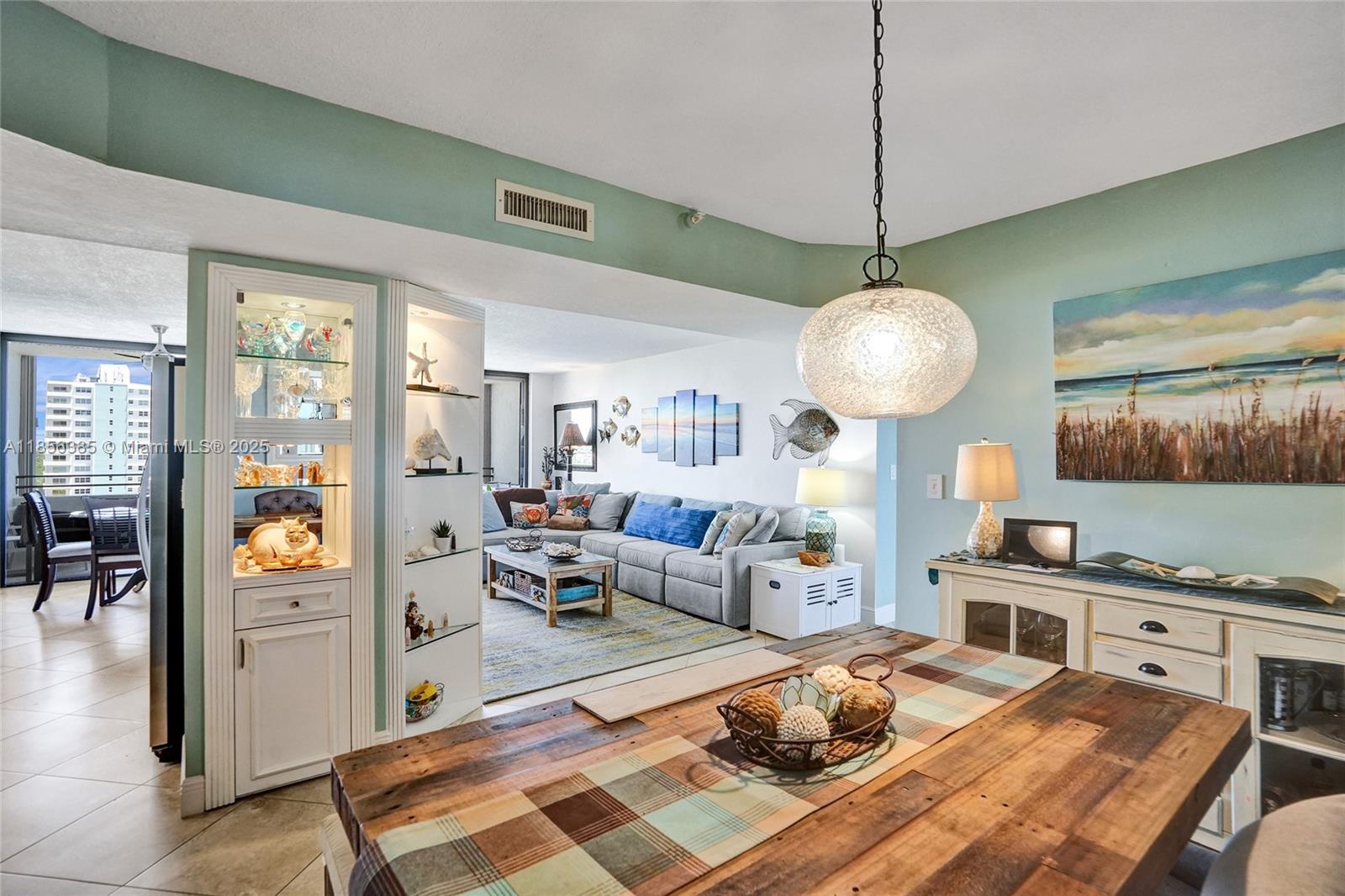 1500 North Ocean Boulevard, Unit 801 Pompano Beach, FL 33062 - Photo 10 of 58 a living room with furniture and a wooden floor