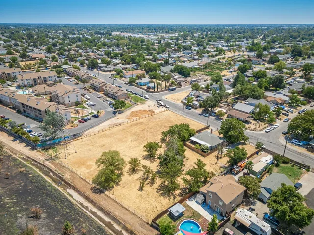 an aerial view of residential houses with outdoor space