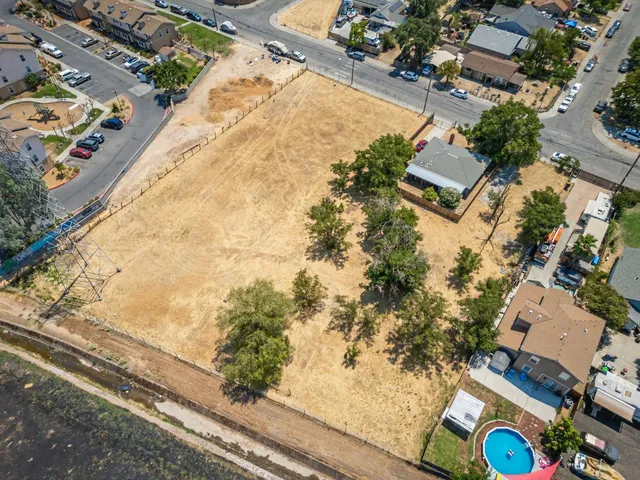 an aerial view of a house with swimming pool and sitting space