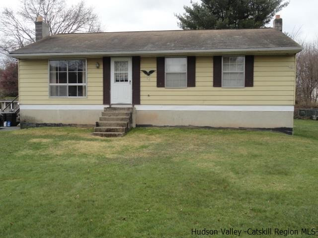 48 Riina Road Wurtsboro, NY 12790 - Photo 3 of 5 a front view of a house with a garden