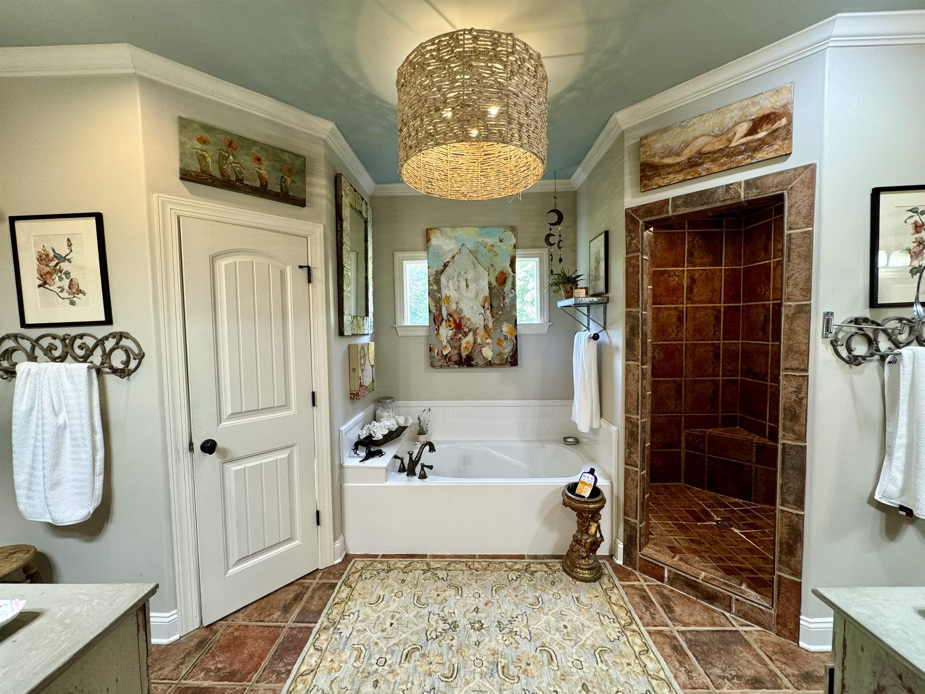 4768 Holly Grove Road Brighton, TN 38011 - Photo 25 of 40 Primary Bath has his/her closets (w/built-in shelves), ceramic tile floor, stand-alone tiled shower, soaker tub, separate vanities and a beautiful chandelier.
