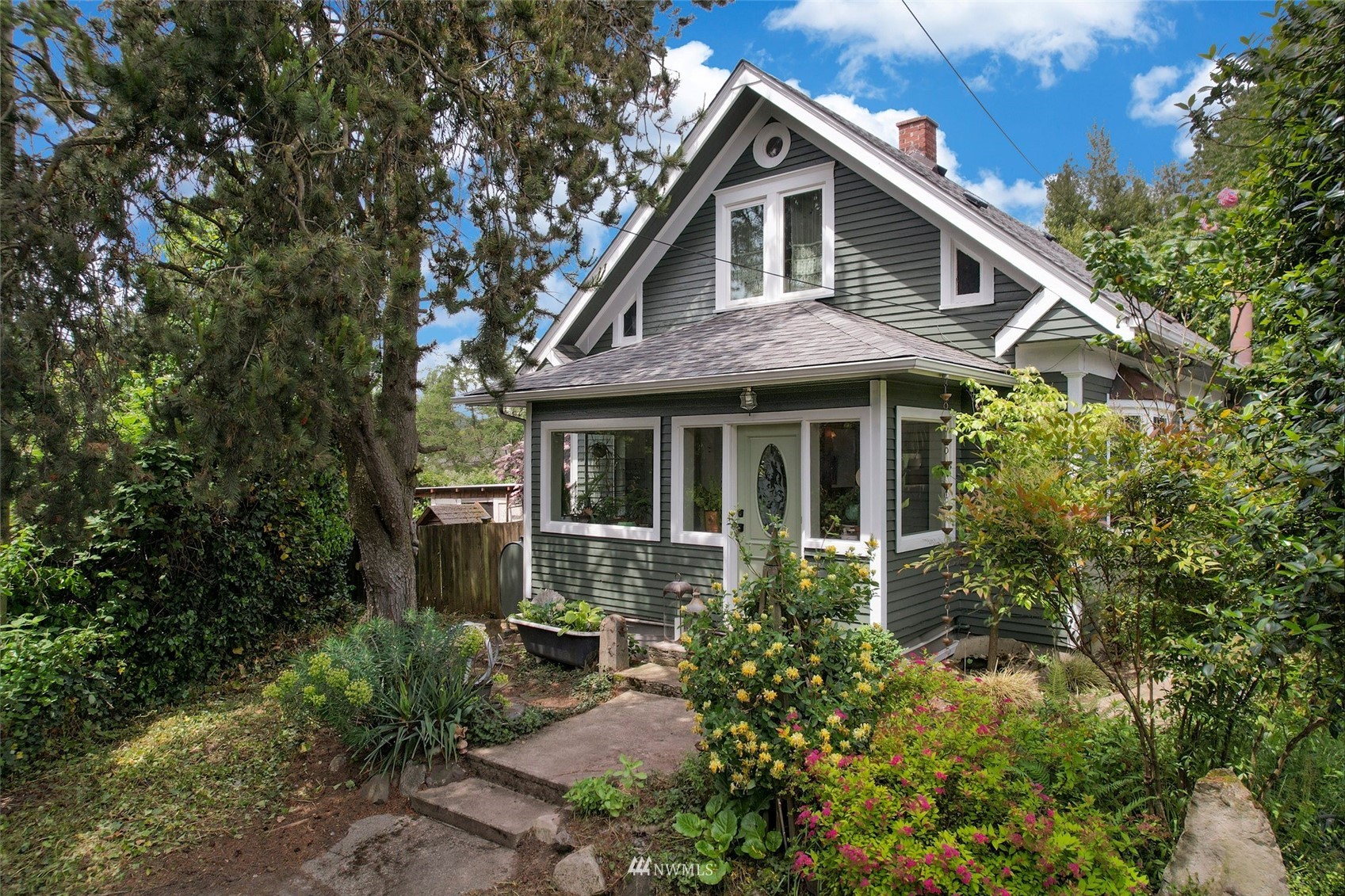 a front view of a house with garden