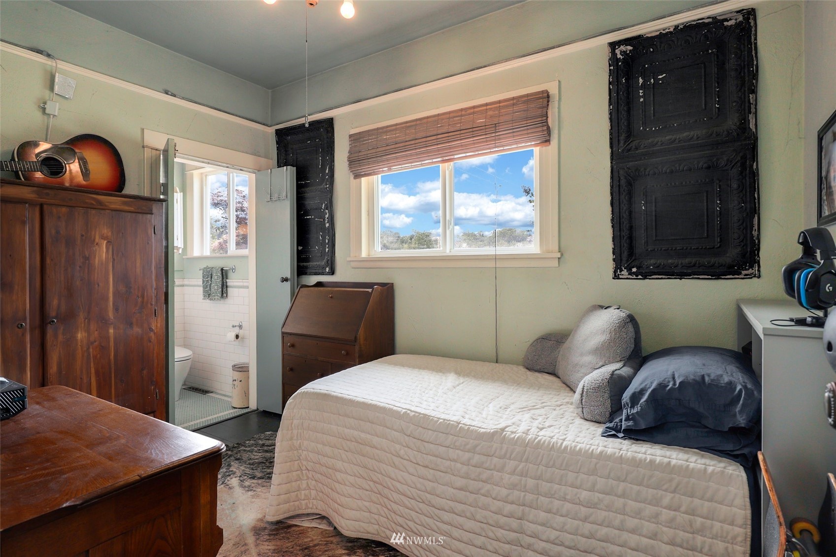 1010 South Director Street Seattle, WA 98108 - Photo 17 of 40 a bedroom with a bed and wooden floor