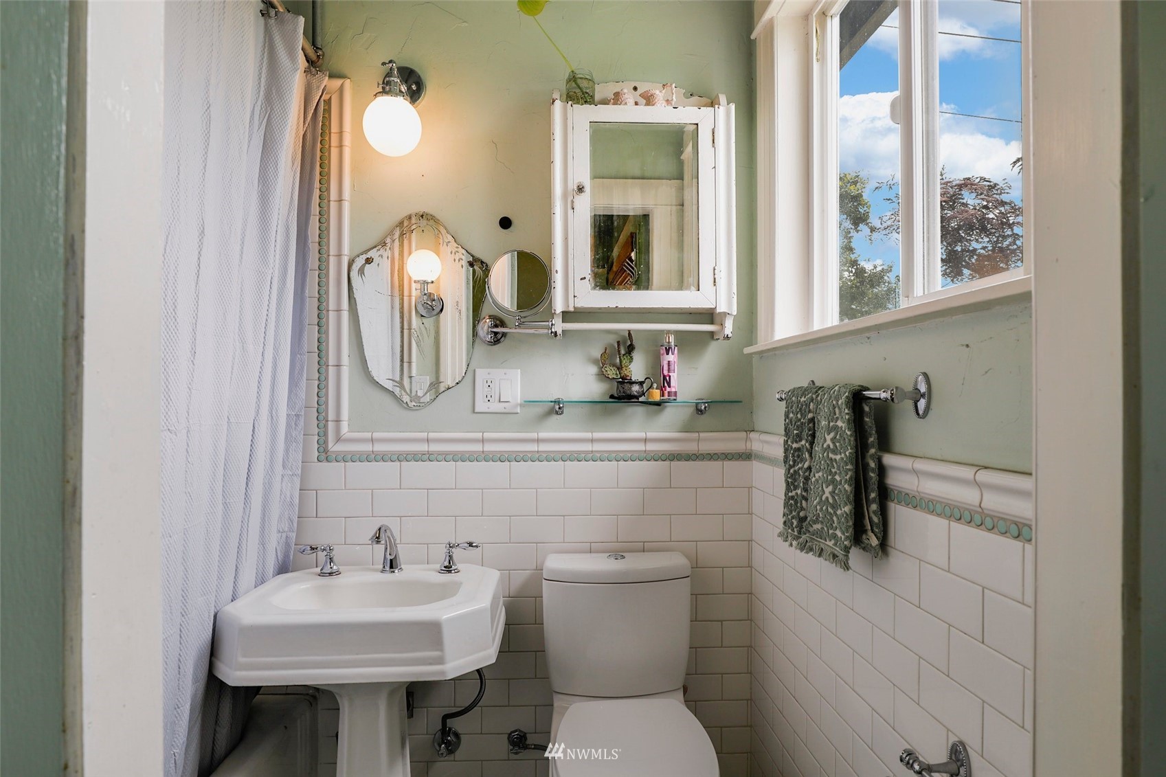1010 South Director Street Seattle, WA 98108 - Photo 19 of 40 a bathroom with a toilet sink and mirror