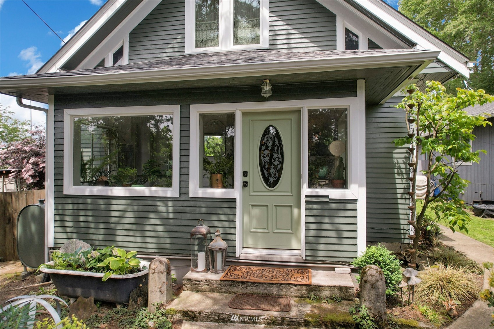 1010 South Director Street Seattle, WA 98108 - Photo 2 of 40 a front view of a house with outdoor seating