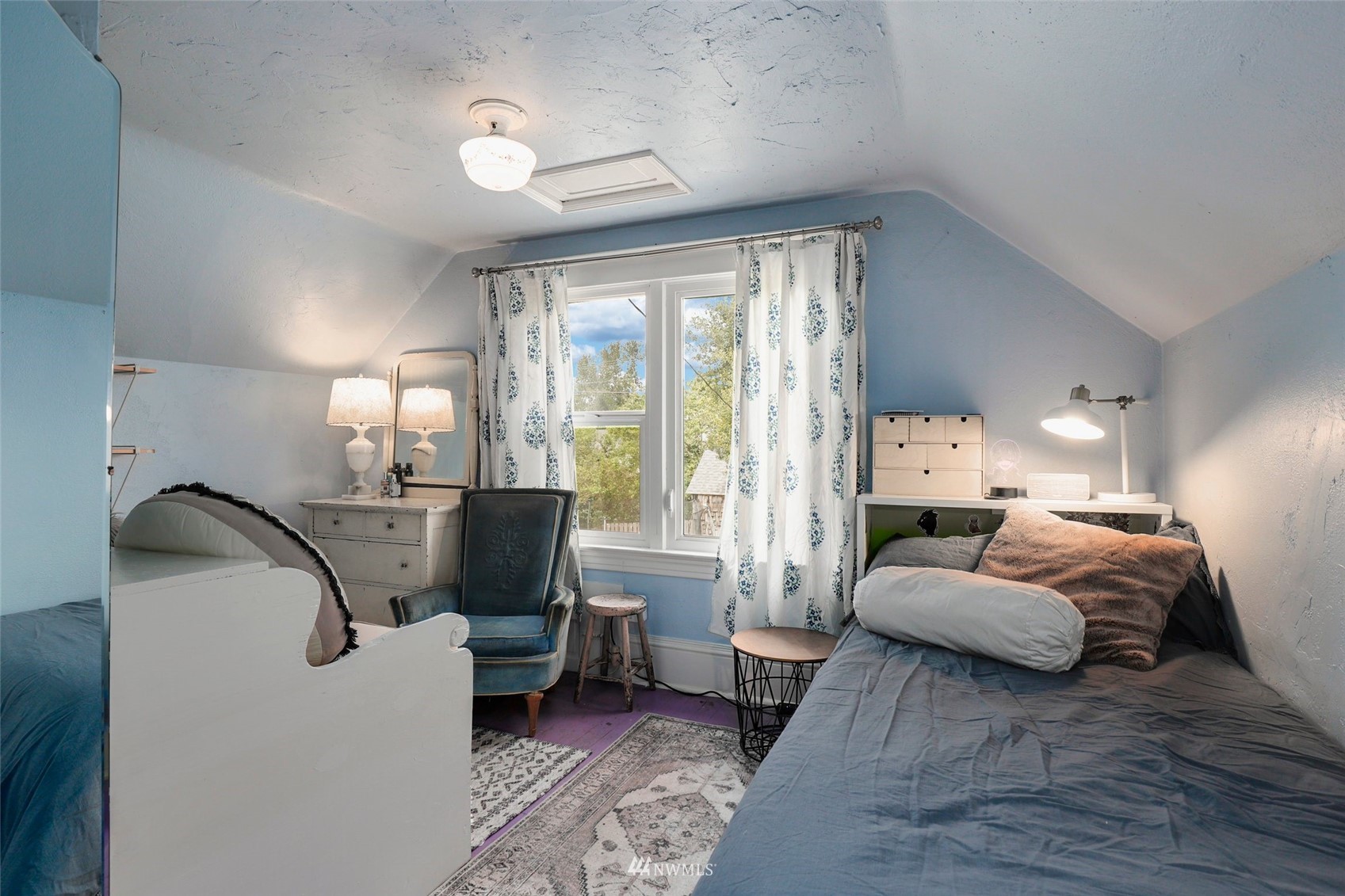 1010 South Director Street Seattle, WA 98108 - Photo 22 of 40 a bedroom with furniture and a window