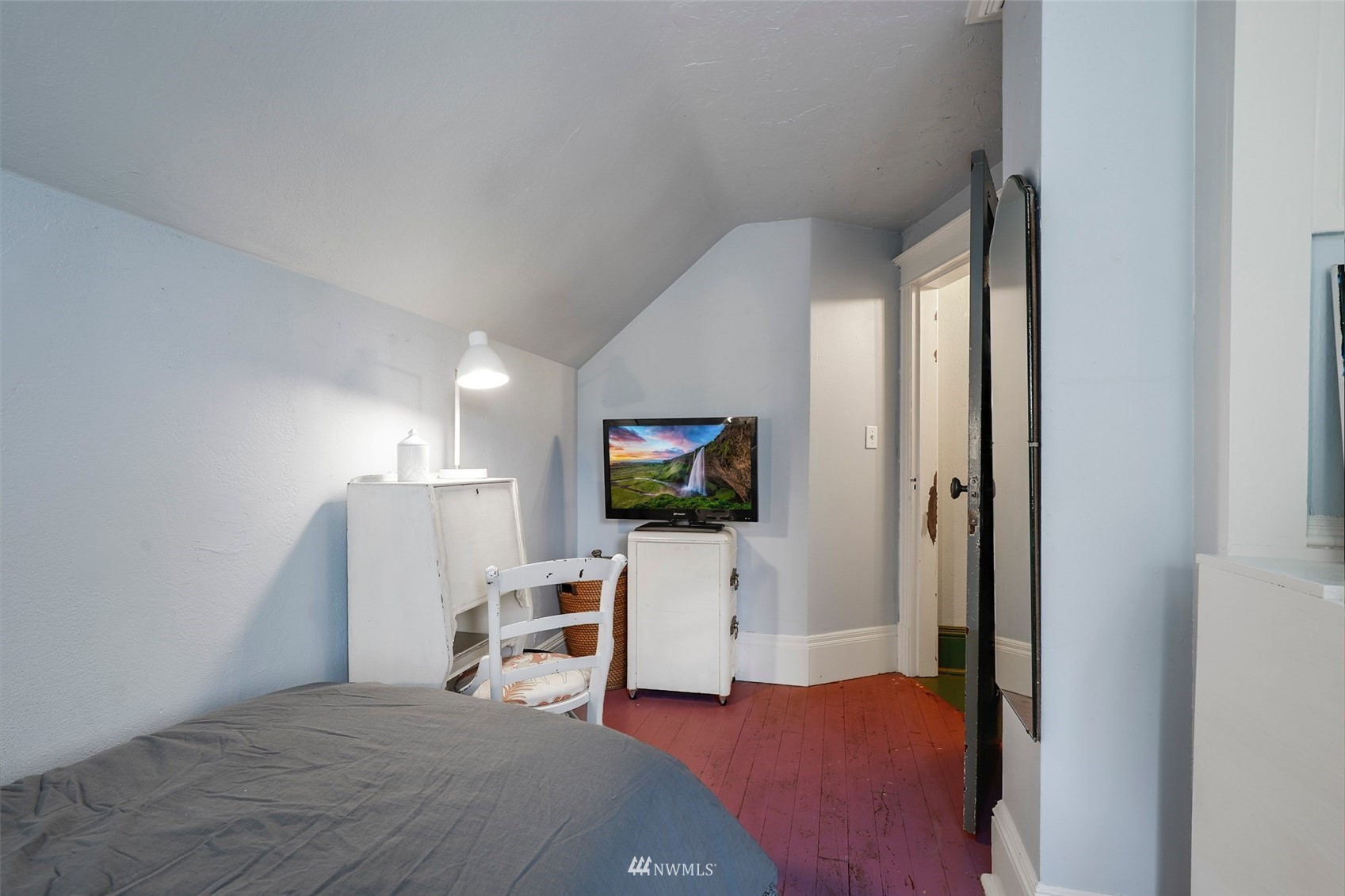 1010 South Director Street Seattle, WA 98108 - Photo 25 of 40 a bedroom with furniture and a flat screen tv