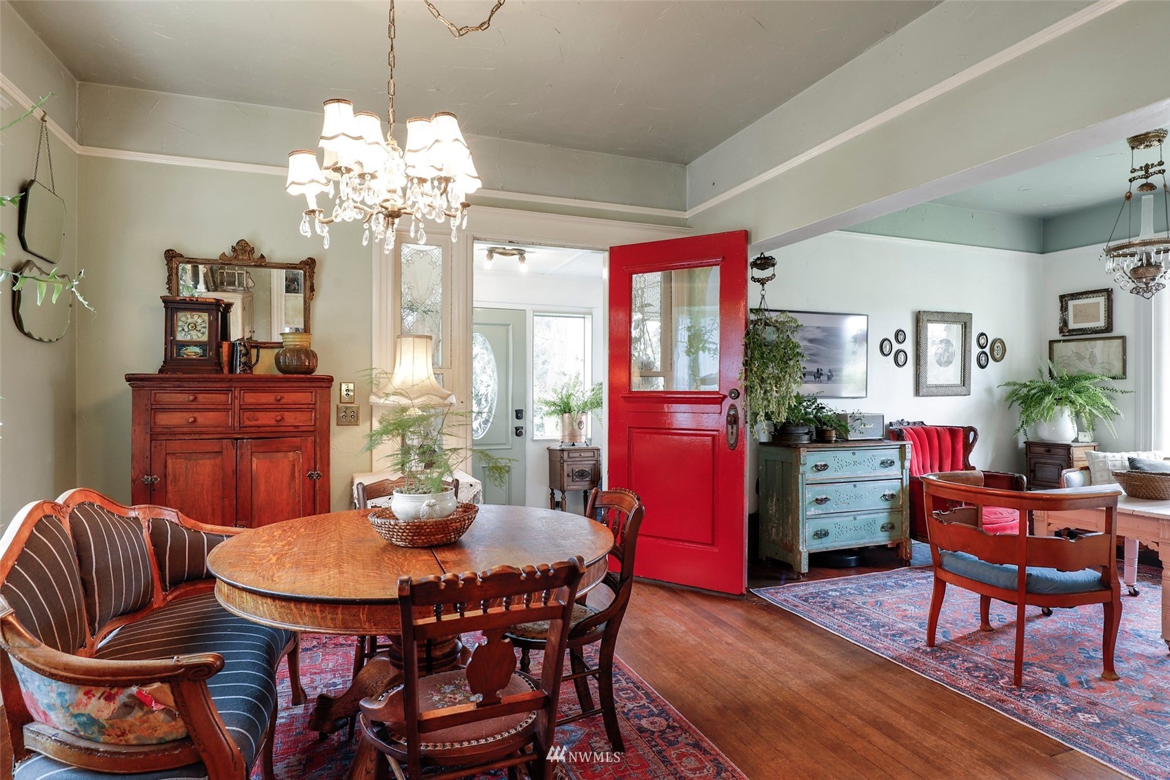 1010 South Director Street Seattle, WA 98108 - Photo 3 of 40 a view of a dining room with furniture a chandelier and wooden floor